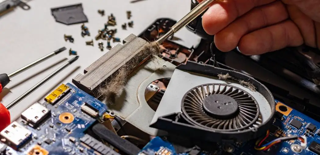 Step two: clean out any dust build-up on fan blades and vent openings | How To Fix An Overheating Laptop: A 2021 Step by Step Guide