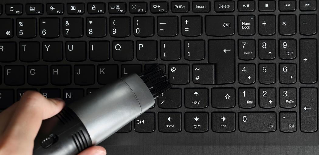 Step four: Spray compressed air within the keyboard keys: