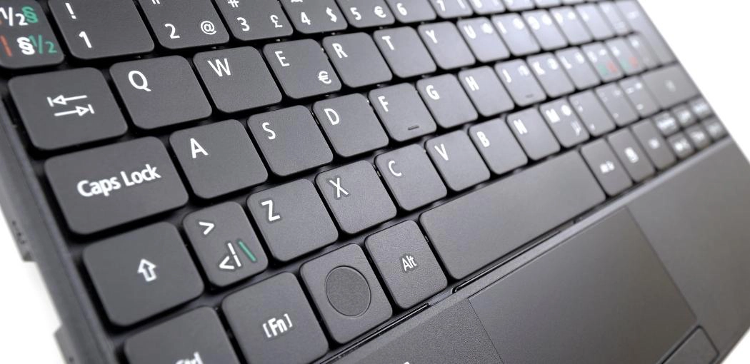 Step three: Flip the laptop and shake it gently: