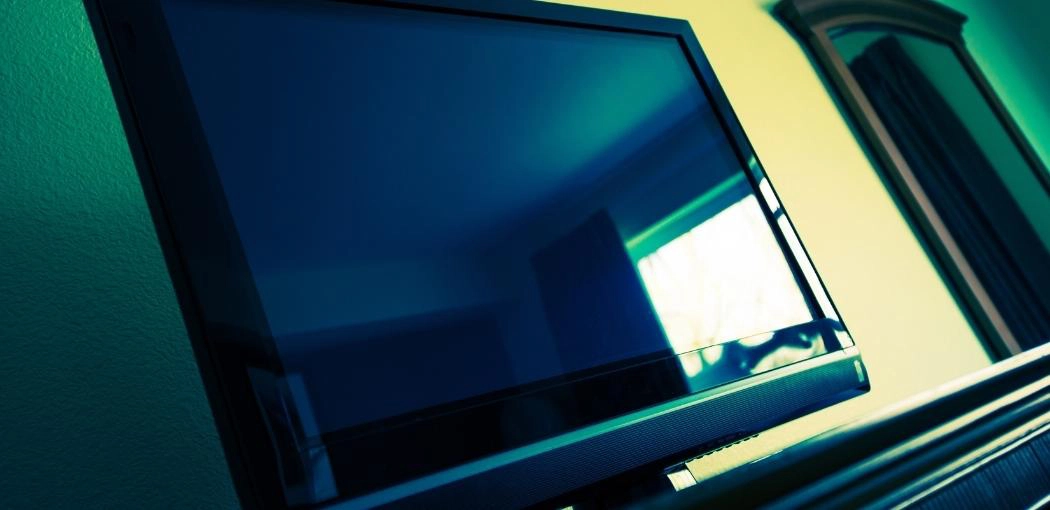 Hide it behind the flat screen tv