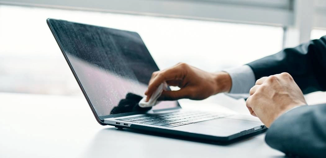 How often should I clean my laptop?